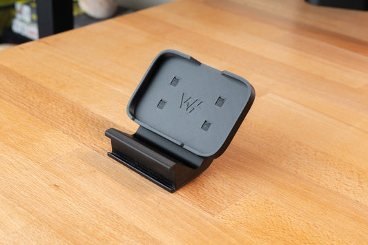 stream deck neo mount for the keyrail system sitting on desk.