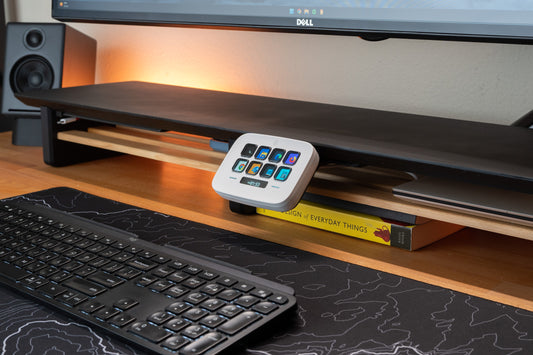 stream deck neo mounted to a desk shelf using the desk rail system.