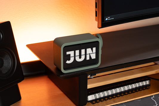 3d printed flip calendar sitting on desk shelf with the month 'JUN' being shown