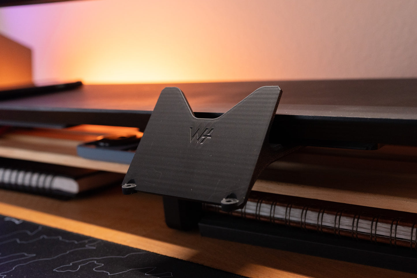 stream deck plus mounted to a desk shelf using the desk rail system shown in black