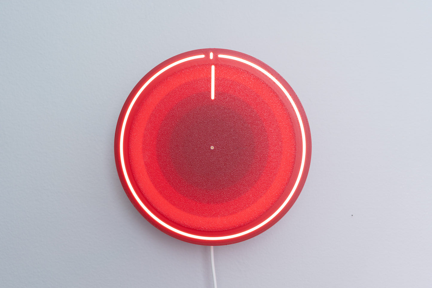 3d printed backlit clock, mounted on gray wall