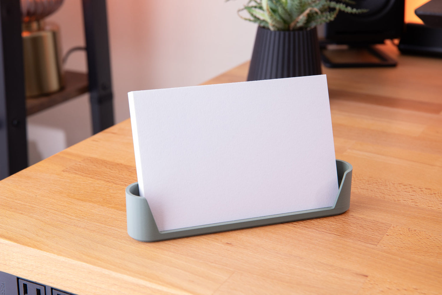 card cradle 3d printed 4x6 notecard holder sitting on desk in green
