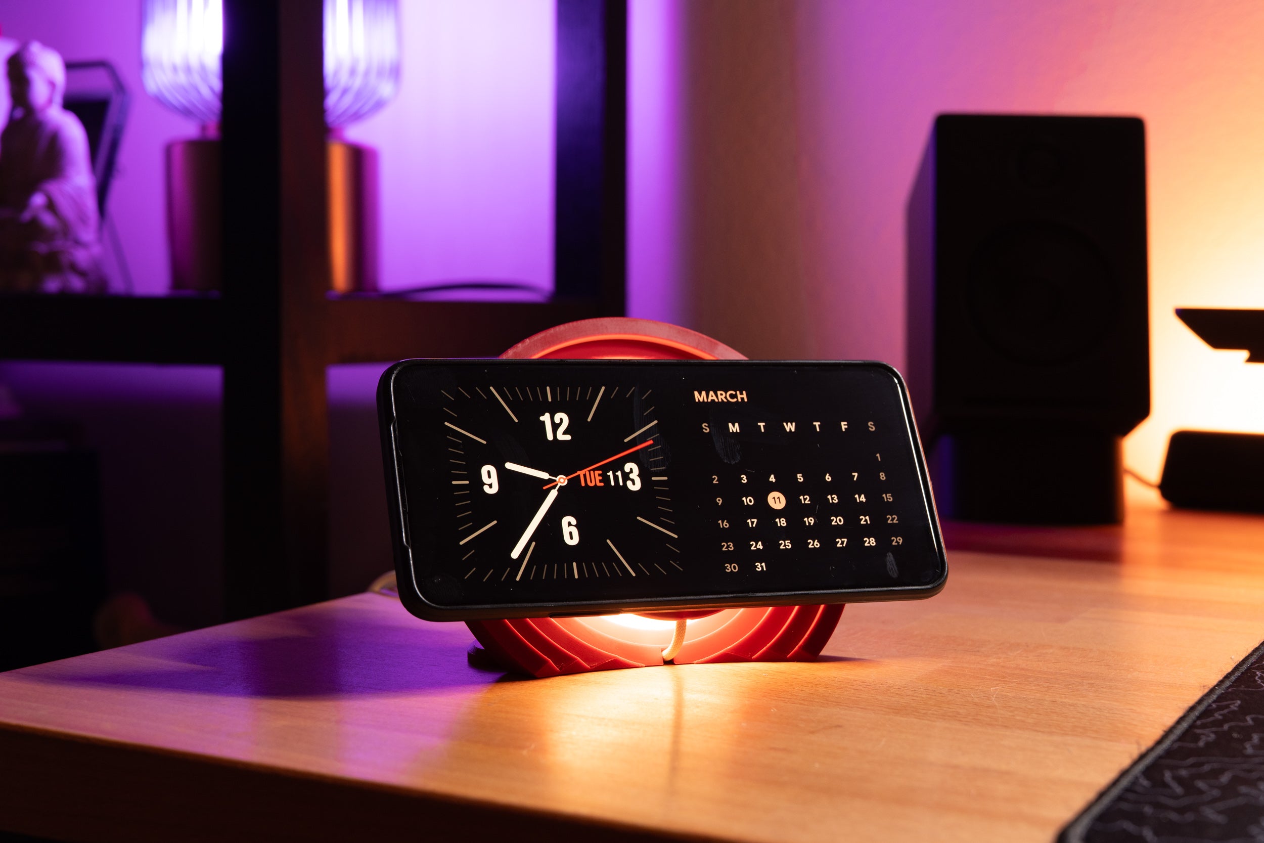 3d printed illuminated radial magsafe mount in red -  shown with phone charging on desk