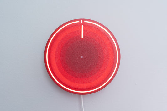 3d printed backlit clock, mounted on gray wall
